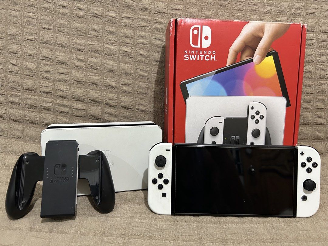 Nintendo Switch OLED Model White with Box (Category: Nintendo) located in Manila. Submitted by vryonsarceno (Listing ID 1470275759, Image 1). Description: FOR SALE NINTENDO SWITCH OLED - Fairly used - With accessories, no HDMI - Hindi na ganon ka-puti yung joycons - No games, sold separately Selling price is 10,500 Can do meetups within Cavite area or shipping through LBC. Reach out to me if interested..
