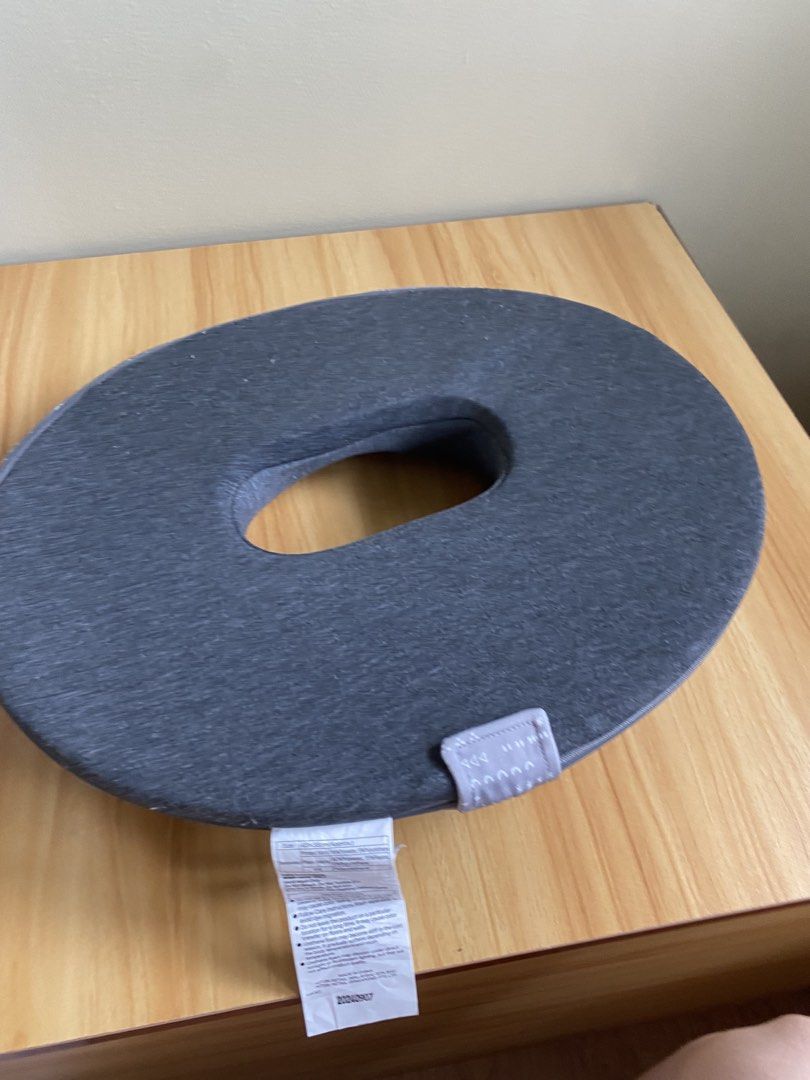 Nitori Donut Seat Cushion (Category: Cushions & Throws) located in San Juan City. Submitted by sabbylexi (Listing ID 1470215861, Image 2). Description: - Ergonomic donut design with central cutout for targeted relief - Soft foam interior for all-day comfort - Removable and washable fabric cover with a convenient side zipper - Stylish grey patterned top with a solid dark grey reverse - Easy maintenance with attached long care label.