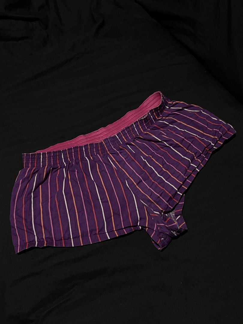 No Boundaries Purple Striped Boxer Shorts (Category: Shorts) located in Manila. Submitted by y2kcloset_ (Listing ID 1470182416, Image 2). Description: - Brand: No Boundaries - Design: Purple base with vertical white, pink, and orange stripes - Waistband: Elastic pink with gathered fabric details - Material: Soft and breathable cotton - Fit: Relaxed cut through the legs for maximum comfort - Best for: Lounging around the house or sleeping - Condit