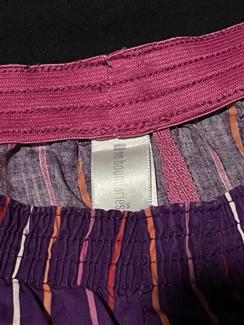 No Boundaries Purple Striped Boxer Shorts (Category: Shorts) located in Manila. Submitted by y2kcloset_ (Listing ID 1470182416, Image 3). Description: - Brand: No Boundaries - Design: Purple base with vertical white, pink, and orange stripes - Waistband: Elastic pink with gathered fabric details - Material: Soft and breathable cotton - Fit: Relaxed cut through the legs for maximum comfort - Best for: Lounging around the house or sleeping - Condit
