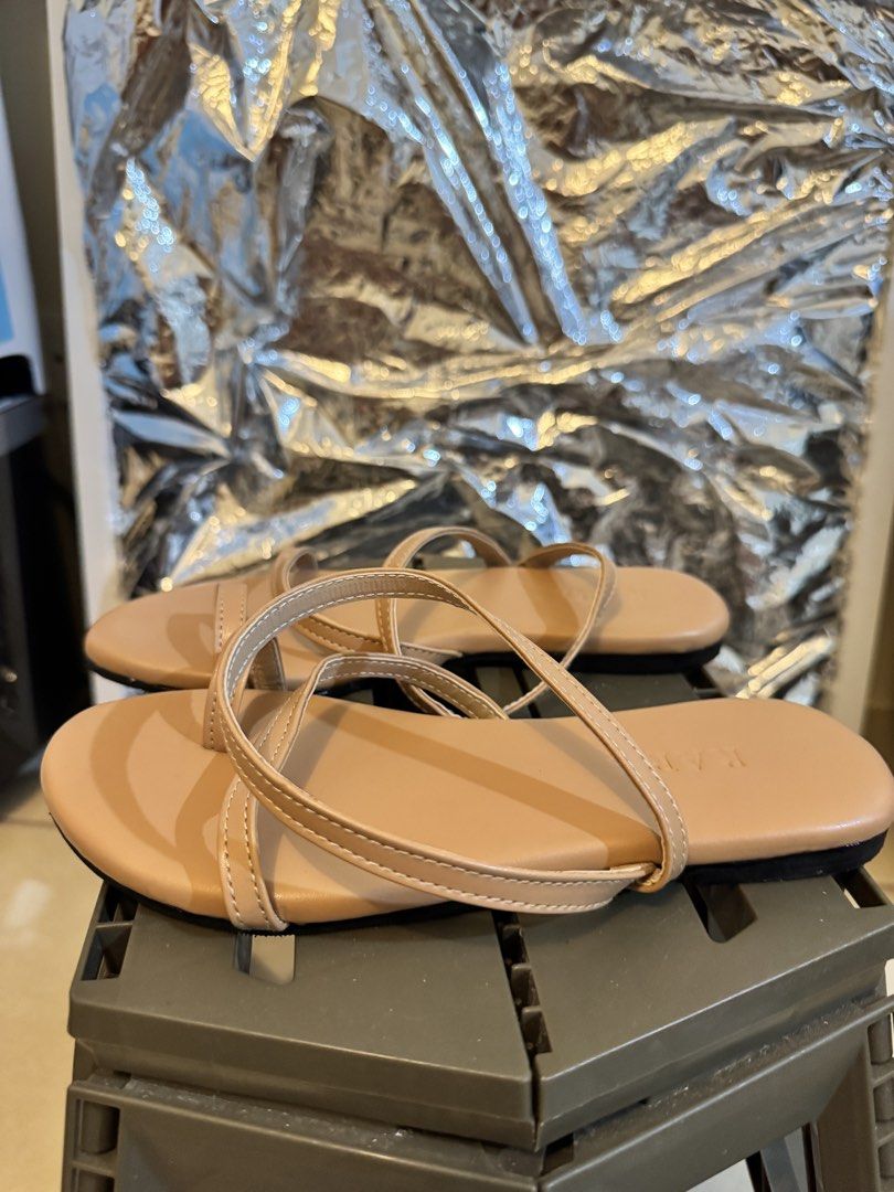 Nude Strappy Flat Sandals (Category: Flats & Sandals) located in Makati City. Submitted by shop2nds (Listing ID 1470242775, Image 1). Description: - Style: Nude strappy flat sandals with a trendy toe loop design - Fit: Easy slip-on style, perfect for everyday casual walks - Color: Versatile neutral beige that matches any summer outfit - Condition: Clean soles with minimal signs of wear.