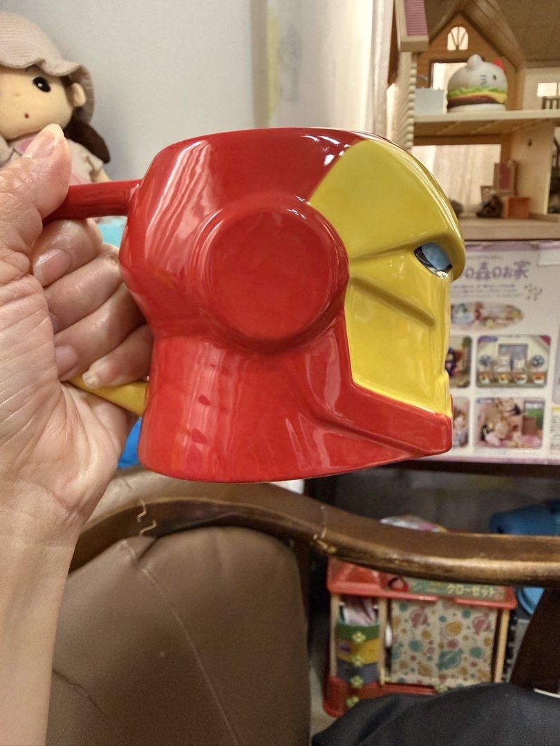 Official Disney Store Marvel Iron Man Ceramic Mug (Category: Coffee & Tea Tableware) located in Mandaue City. Submitted by erin_grace (Listing ID 1470165648, Image 2). Description: - Official Disney Store & Marvel merchandise - Iron Man helmet design with glossy red and yellow finish - Suit-inspired handle for a comfortable grip - Comes with original Disneyland Hong Kong price sticker - 100% brand new and never used - Great gift for MCU collector