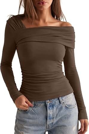 Off-shoulder long sleeve draped top (Category: Longsleeves) located in San Carlos. Submitted by my.excess.stuff (Listing ID 1470344304, Image 1). Description: - Color: Black - Style: Off-shoulder long sleeve with draped overlay neckline - Fit: Body-hugging soft stretch fabric with flattering ruched sides - Size: Medium (tag attached) - Versatile piece: Great for going out or pairing with denim jeans.