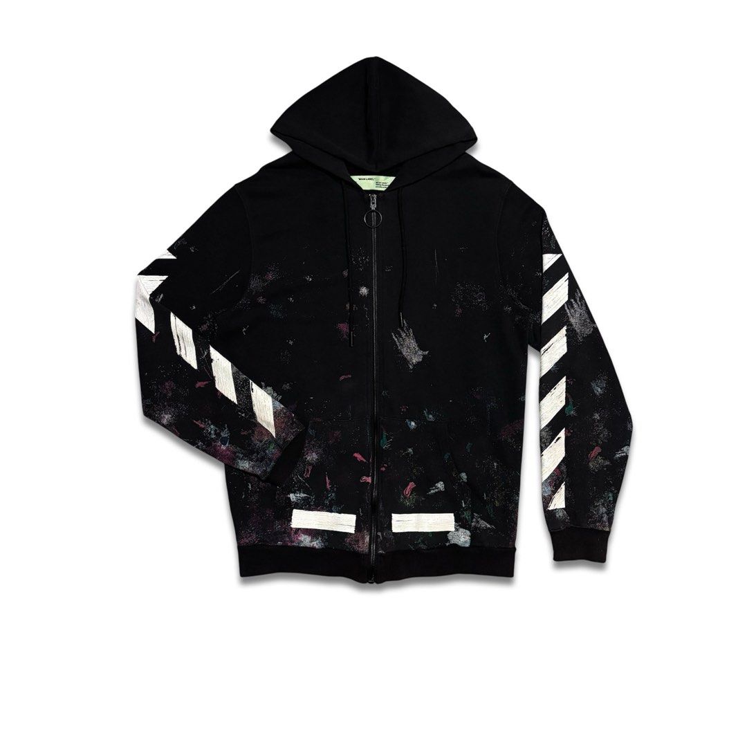 Off-White Paint Splatter Zip-Up Hoodie (Category: Coats, Jackets and Outerwear) located in Caloocan City. Submitted by jerichotad22965 (Listing ID 1470196944, Image 1). Description: - Brand: Off-White - Color: Black with paint splatter effect throughout - Design: Signature sleeve diagonals, large back brush arrow graphic, and 'SEEING THINGS' lettering - Details: Green 'MAIN LABEL' collar tag with 2019 copyright, diagonal stripe wash tag, and ring
