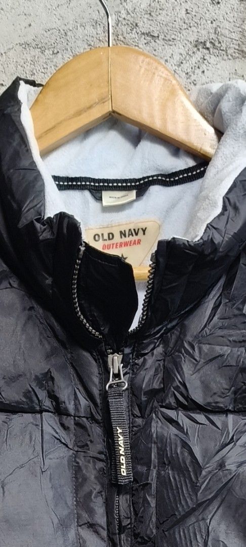 Old Navy Outerwear Puffer Jacket (Category: Coats, Jackets and Outerwear) located in Makati City. Submitted by thriftersmakati (Listing ID 1470148066, Image 2). Description: - Brand: Old Navy - Color: Classic Black - Material: Quilted nylon outer shell with soft, cozy fleece lining - Features: High collar, full zip front, branded zipper pull.
