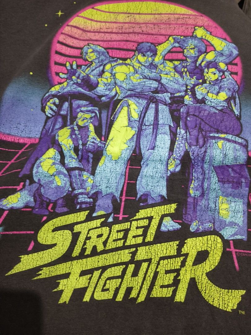 Old Navy Street Fighter Graphic Tee Size L (Category: Tshirts & Polo Shirts ) located in Manila. Submitted by icesummer.onlineshop (Listing ID 1470154257, Image 2). Description: - Brand: Old Navy - Item: Street Fighter Graphic T-Shirt - Color: Grey - Size: Large - Design: Classic Street Fighter characters with retro synthwave sunset background and intentional vintage crackle texture - Details: short sleeves - Origin: Made in Nicaragua (Production