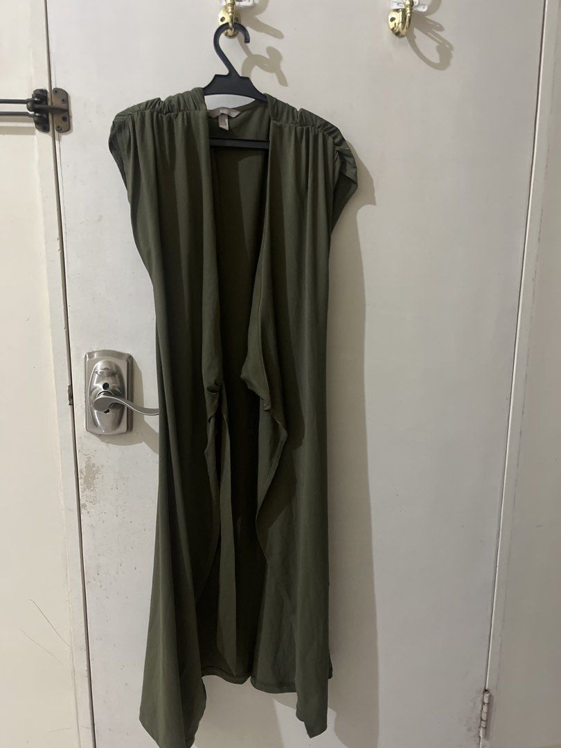 Olive Green Open Front Long Cardigan Vest (Category: Coats, Jackets and Outerwear) located in Caloocan City. Submitted by jhamdvilla82434 (Listing ID 1470250605, Image 1). Description: - Color: Olive green - Style: Sleeveless long cardigan with open front and draped sides - Details: Lightweight fabric with gathered shoulders - Fit/Use: Great casual layering piece - Condition: Excellent, no flaws noticed.