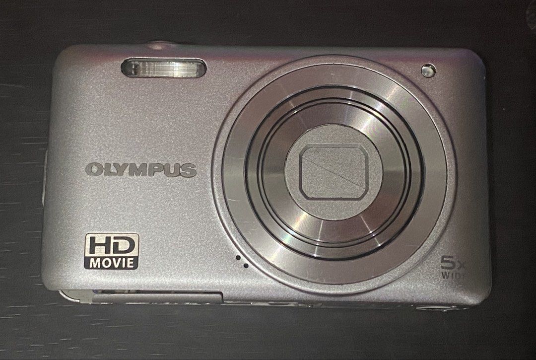 Olympus VG-130 Silver 14MP Digital Camera (Category: Cameras) located in Manila. Submitted by myiao (Listing ID 1470296333, Image 1). Description: Olympus VG-130 Silver 14 Megapixels Digital Camera - can both capture and record CONDITION: Body condition - 9/10 - ALL buttons working - Flash working - Red light working - Zoom working - Minor lcd issue (shows one line, doesnt affect output) - Cracks on battery door, but still locks properly INCLUSIO