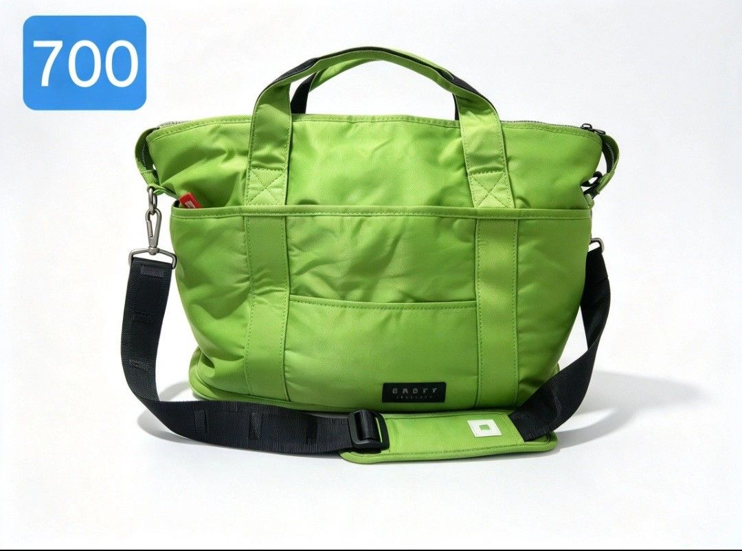 Travel bag (Category: Shoulder Bags) located in Angeles City. Submitted by anneps (Listing ID 1470213325, Image 1). Description: - Brand: ONOFF - Color: Bright lime green with black strap and red accents - Features 'Golf matters' branding patch on the front - Double top handles and wide detachable black shoulder strap with padded cushion - Secure silver zip closure with red pull tabs - Front slip pockets for quick access - Spacious interior with 