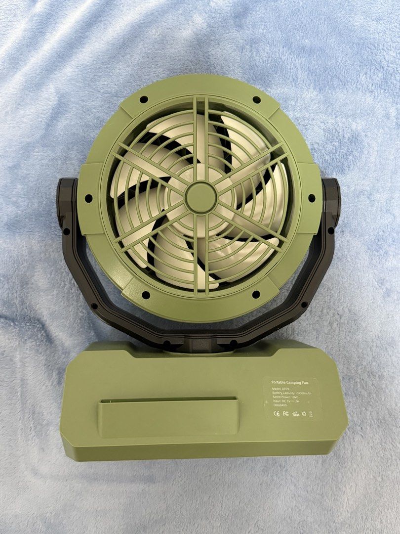 Orashare Portable Camping Fan DF09 Green (Category: Fans) located in Malolos. Submitted by jaizemndz22 (Listing ID 1470274105, Image 2). Description: - Model: Orashare DF09 Portable Camping Fan (Green) - Massive 20000mAh battery capacity for long-lasting use - 10W rated power with DC 5V 2A input - Built-in LED lights around the frame for illumination - Multi-function control buttons on a sturdy base - Adjustable tilt angle for precise airflow dir