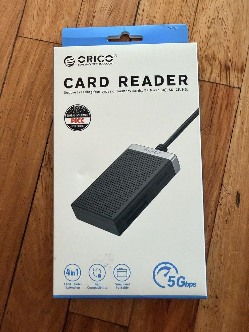 ORICO 4-in-1 Card Reader 5Gbps Type-C (Category: Other Photography Accessories) located in Makati City. Submitted by secondhand_finds (Listing ID 1470183101, Image 1). Description: - Brand: ORICO - Type: 4-in-1 Memory Card Reader - Slots: TF, Micro SD, SD, CF, and MS cards - Connection: USB Type-C with up to 5Gbps data transfer speed - Design: Compact, stylish black and silver finish - Condition: Brand new, unopened retail packaging.