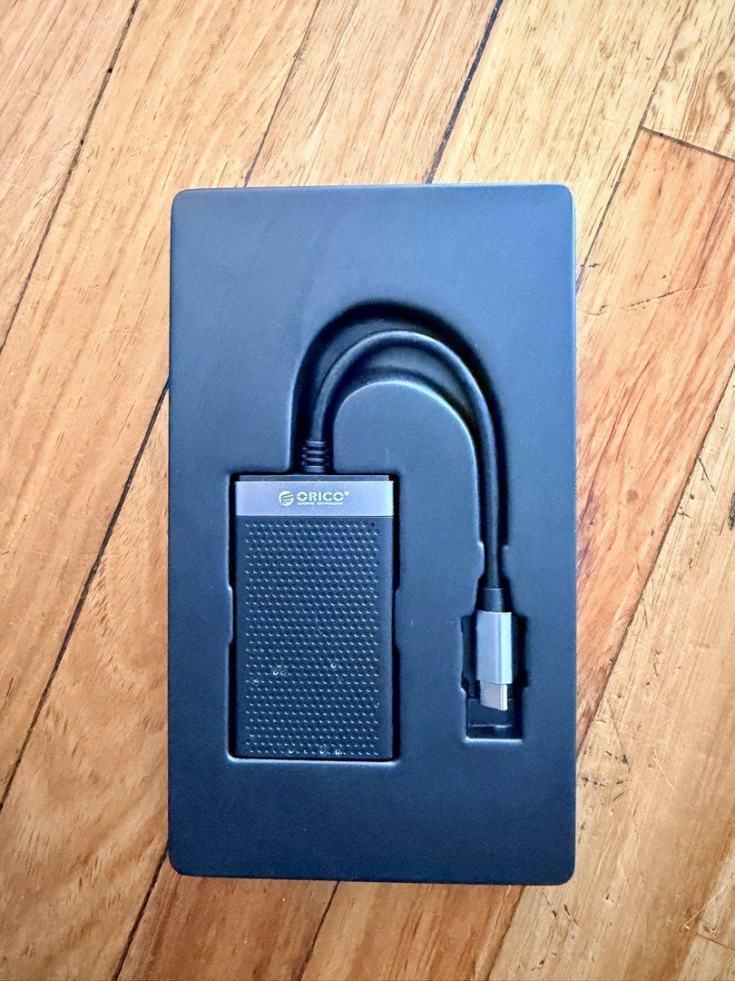 ORICO 4-in-1 Card Reader 5Gbps Type-C (Category: Other Photography Accessories) located in Makati City. Submitted by secondhand_finds (Listing ID 1470183101, Image 3). Description: - Brand: ORICO - Type: 4-in-1 Memory Card Reader - Slots: TF, Micro SD, SD, CF, and MS cards - Connection: USB Type-C with up to 5Gbps data transfer speed - Design: Compact, stylish black and silver finish - Condition: Brand new, unopened retail packaging.
