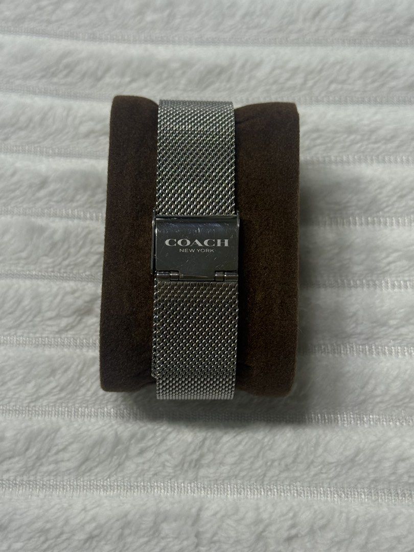 ORIGINAL Coach Perry 14504100 Watch (Category: Women's Watches) located in Manila. Submitted by fatz91 (Listing ID 1470218679, Image 3). Description: Coach Perry 14504100 Watch The visual highlight is the white dial with twelve lavender/purple floral markers. That combination gives it more personality than a conventional silver dress watch while remaining fairly understated from a distance; the mesh bracelet also makes it easy to pair with jewelr