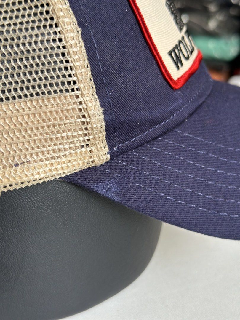 OTTO Wolftown VA Trucker Hat Navy Tan Snapback (Category: Caps & Hats) located in Daet. Submitted by thrifthings2018 (Listing ID 1470204933, Image 3). Description: - Brand: OTTO - Colorway: Navy front with tan mesh back - Design: Embroidered 'Wolftown, VA' patch with howling wolf graphic - Closure: Adjustable tan snapback - Condition: Clean inner sweatband, structured panels, ready to wear.