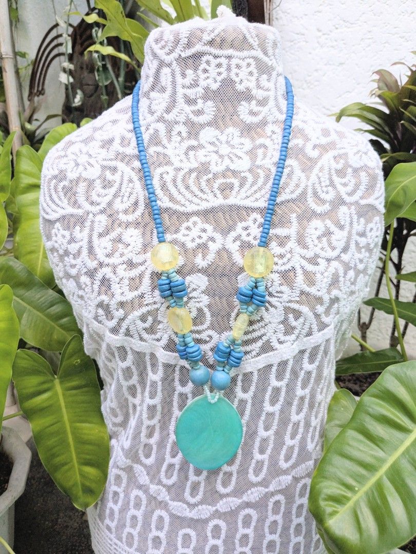 Oval Shell Pendant (Blue) Handcrafted Necklace (Category: Necklaces) located in Las Pinas. Submitted by amisells (Listing ID 1470224004, Image 1). Description: ⋆⊱༻𖥸༺⊰⋆ every piece in our collection is thoughtfully handcrafted using an exquisite selection of locally sourced natural materials! discover the beauty of authentic craftsmanship through coconut heishi beads, lumbang seed beads, bayong and gmelina wood beads, coco side-drill beads, one-e