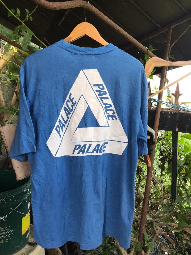 Palace Blue Tri-Ferg Tee (Category: Tshirts & Polo Shirts ) located in Camiling. Submitted by akosiano (Listing ID 1470156793, Image 2). Description: - Brand: Palace - Size: Large - Design: Classic small tri-ferg logo on the chest, giant tri-ferg graphic on the back - Details: Clean white neck tag with size tab attached - Material: Comfortable cotton - Styling: Great streetwear essential, easy to pair with cargo pants or denim.