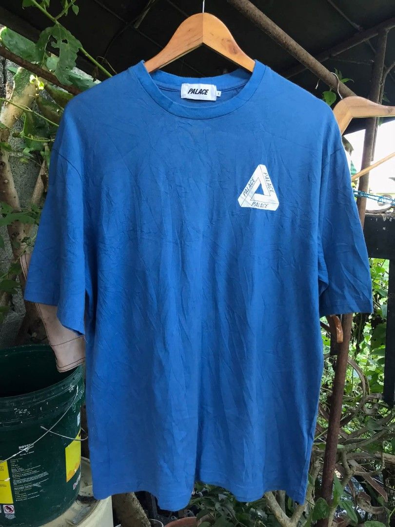 Palace Blue Tri-Ferg Tee (Category: Tshirts & Polo Shirts ) located in Camiling. Submitted by akosiano (Listing ID 1470156793, Image 1). Description: - Brand: Palace - Size: Large - Design: Classic small tri-ferg logo on the chest, giant tri-ferg graphic on the back - Details: Clean white neck tag with size tab attached - Material: Comfortable cotton - Styling: Great streetwear essential, easy to pair with cargo pants or denim.