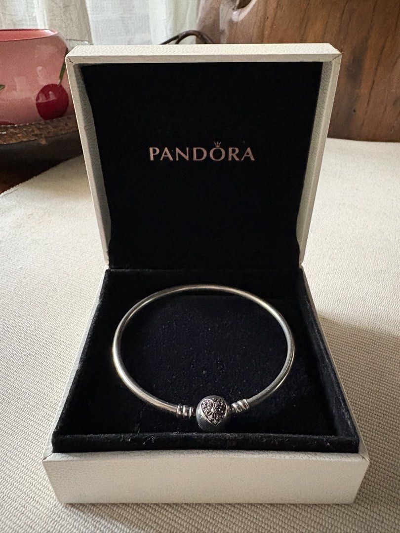 Pandora Bangle Bracelet with Heart Clasp in Box (Category: Bracelets) located in Las Pinas. Submitted by cartby_a (Listing ID 1470238296, Image 1). Description: Pandora Sterling Silver Bangle - Genuine Pandora silver bangle bracelet - Features a detailed heart spherical clasp - Includes original white Pandora gift box with black velvet lining .
