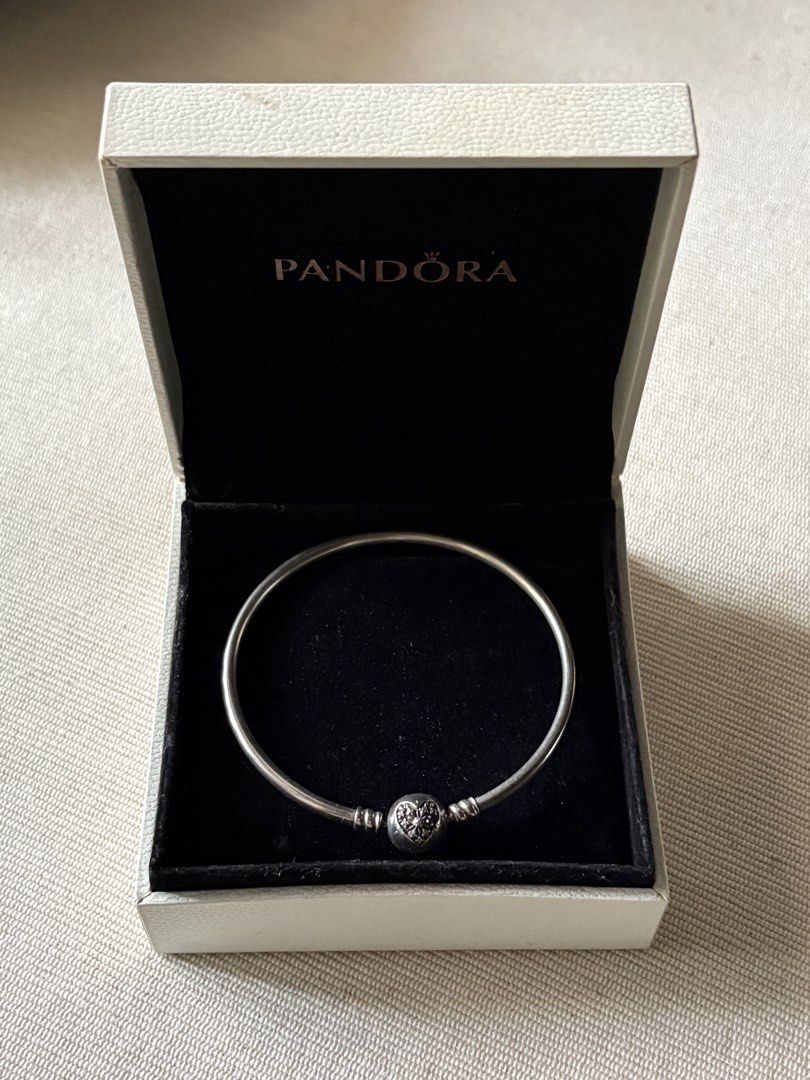 Pandora Bangle Bracelet with Heart Clasp in Box (Category: Bracelets) located in Las Pinas. Submitted by cartby_a (Listing ID 1470238296, Image 2). Description: Pandora Sterling Silver Bangle - Genuine Pandora silver bangle bracelet - Features a detailed heart spherical clasp - Includes original white Pandora gift box with black velvet lining .