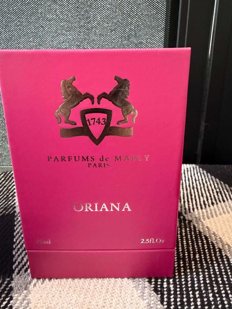 Parfums de Marly Oriana Eau de Parfum 75ml (Category: Fragrance & Deodorants) located in Manila. Submitted by jam_isa21 (Listing ID 1470224842, Image 2). Description: - Brand: Parfums de Marly - Fragrance: Oriana - Size: 75ml - Bottle Design: Vibrant pink frosted glass with silver cap and matching tassels - Packaging: Original velvet presentation box included.