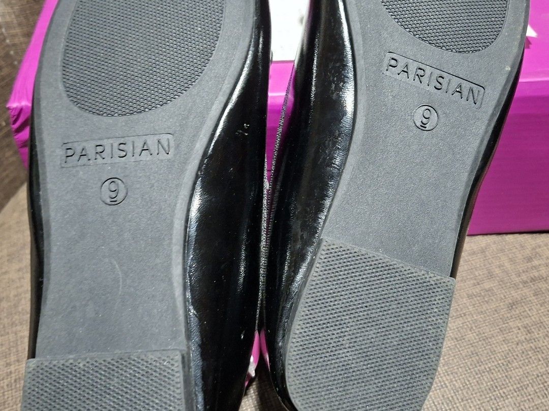 Parisian Black Bela Ballet Flats Size 9 (Category: Flats & Sandals) located in Makati City. Submitted by paudeclutters (Listing ID 1470280631, Image 3). Description: - Brand: Parisian (Model: Bela) - Color & Finish: Black with a glossy shine - Size: 9 - Details: Cute bow on top with a stylish strap across the foot - Condition: Brand new, never worn, with original - Packaging: Comes in the original pink Parisian shoebox - with signs of storage.