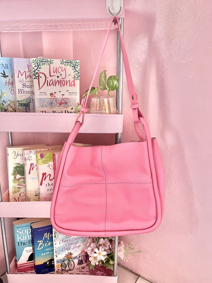 Parisian Pink Shoulder Bag (Category: Shoulder Bags) located in Imus. Submitted by muyingyingyinggg (Listing ID 1470237361, Image 1). Description: - Brand: Parisian - Color: Bright pink - Material: Soft textured material with stylish front panel stitching - Closure: Zipper with branded gold-toned metal pull - Interior: Spacious matching pink interior for daily essentials - Strap: Comfortable drop strap that easily fits over the shoulder - Conditi