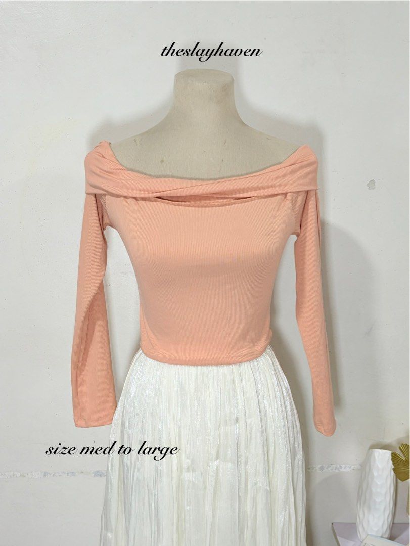 Peach Off-Shoulder Ribbed Long Sleeve Top (Category: Longsleeves) located in Manila. Submitted by biacakes (Listing ID 1470263052, Image 1). Description: - Color: Peach - Style: Off-shoulder ribbed top with long sleeves - Fit: Fitted cut, fits Medium to Large comfortably - Material: Soft and stretchy - Versatility: Easy to pair with jeans or a skirt.