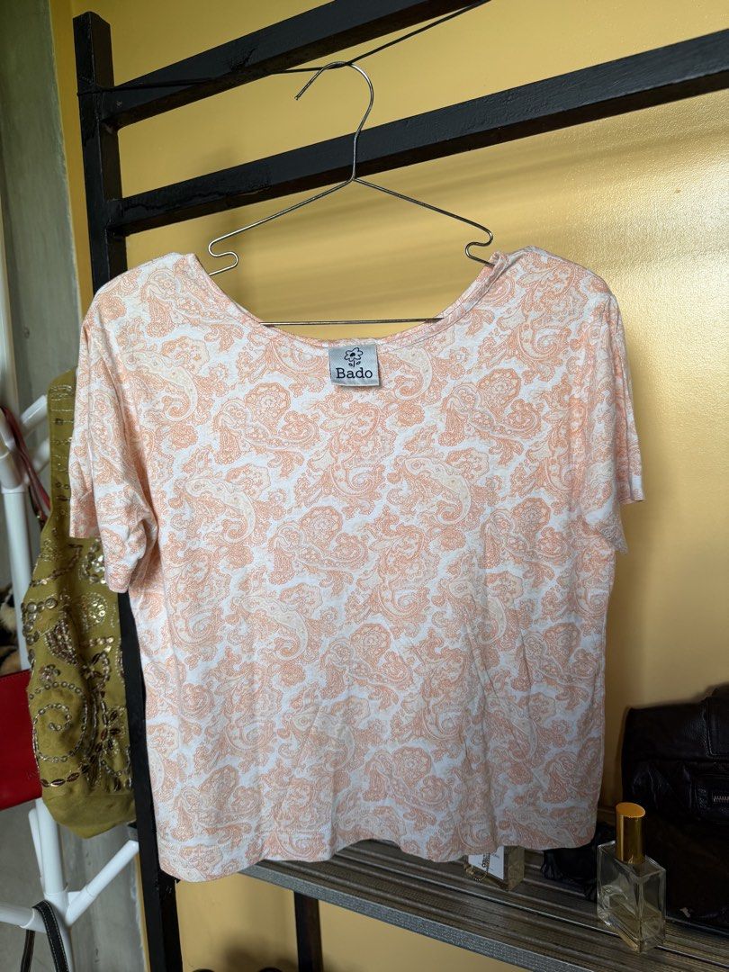 Peach Paisley Pattern Short Sleeve Top (Category: Blouses) located in Legazpi City. Submitted by hapie_haus (Listing ID 1470270149, Image 2). Description: P 100. Size small- medium Piece 1- Peach and white with all-over paisley print P 149. Size small - medium Piece 2- long sleeve crop top P 149. Size small Piece 3 long sleeve black , the fabric feels like slippery, cool to touch and slightly glossy. swim like fabric/ sporty top .