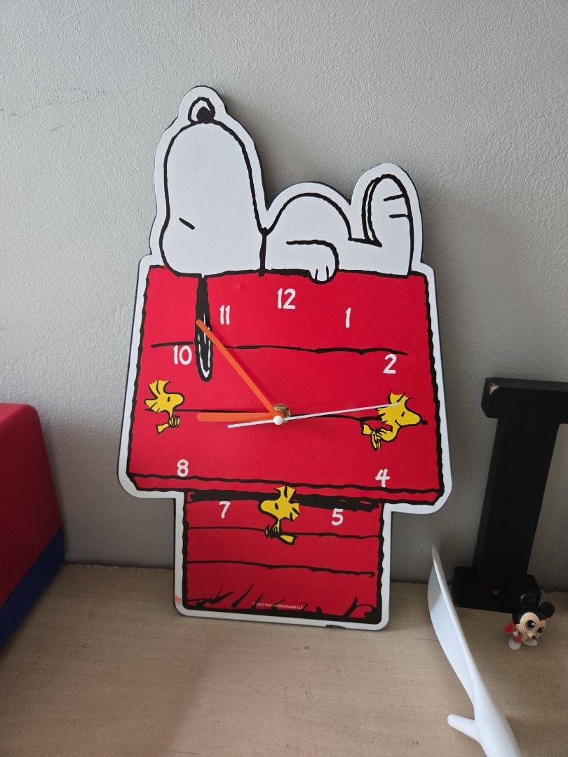 Peanuts Snoopy Red Doghouse Wall Clock (Category: Clocks) located in Pasig City. Submitted by izzy0202 (Listing ID 1470146635, Image 1). Description: - Iconic Snoopy red doghouse design - Features adorable Woodstock illustrations by the numbers - Vibrant red finish with white and black outline details - Includes standard clock hands - Perfect for Peanuts collectors or cute bedroom decor - Ships securely from a trusted seller.