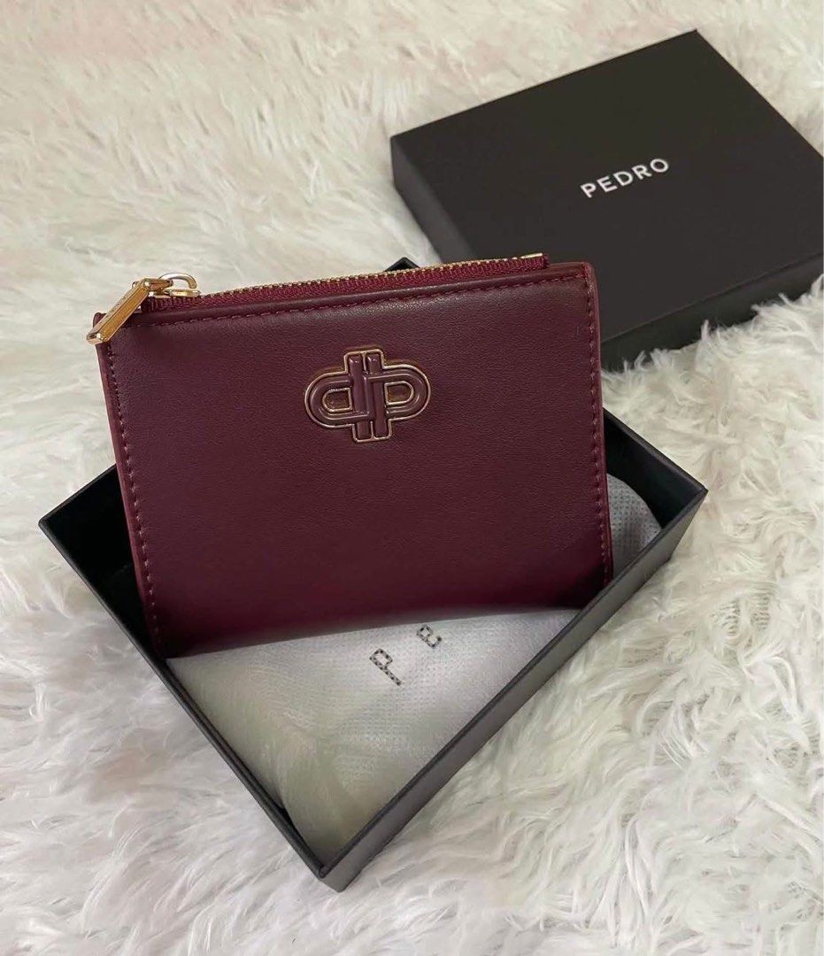 Pedro Maroon Wallet with Box (Category: Wallets & Card holders) located in Manila. Submitted by manilynpitero (Listing ID 1470144164, Image 2). Description: - Brand: Pedro - Color: Maroon - Material: Real leather - Design: Compact bifold with snap button closure - Hardware: Gold tone - Features: Front zipper coin compartment and multiple card slots - Condition: Brand new with tags attached - Inclusion: box included.