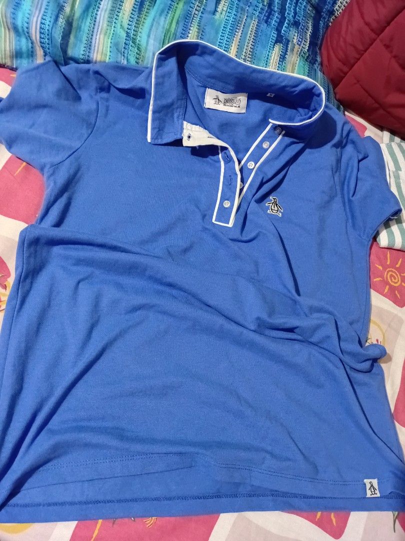 Penguin polo top (Category: Blouses) located in Bacoor. Submitted by yaniracha__ (Listing ID 1470323990, Image 1). Description: pm for more details bust 42 armhole 14 length 27 rfs: not complimenting sa undertone ko ps maganda ang tela nito pique fabric bought from shapi cilebritee 2.0.