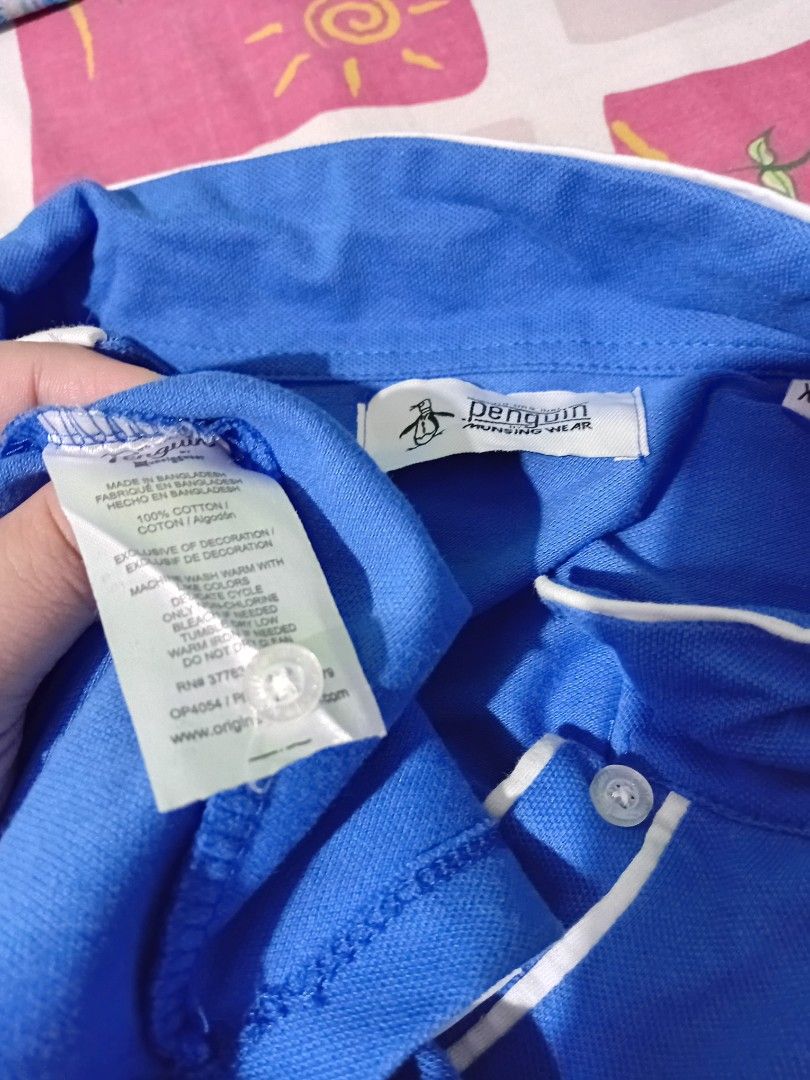 Penguin polo top (Category: Blouses) located in Bacoor. Submitted by yaniracha__ (Listing ID 1470323990, Image 2). Description: pm for more details bust 42 armhole 14 length 27 rfs: not complimenting sa undertone ko ps maganda ang tela nito pique fabric bought from shapi cilebritee 2.0.