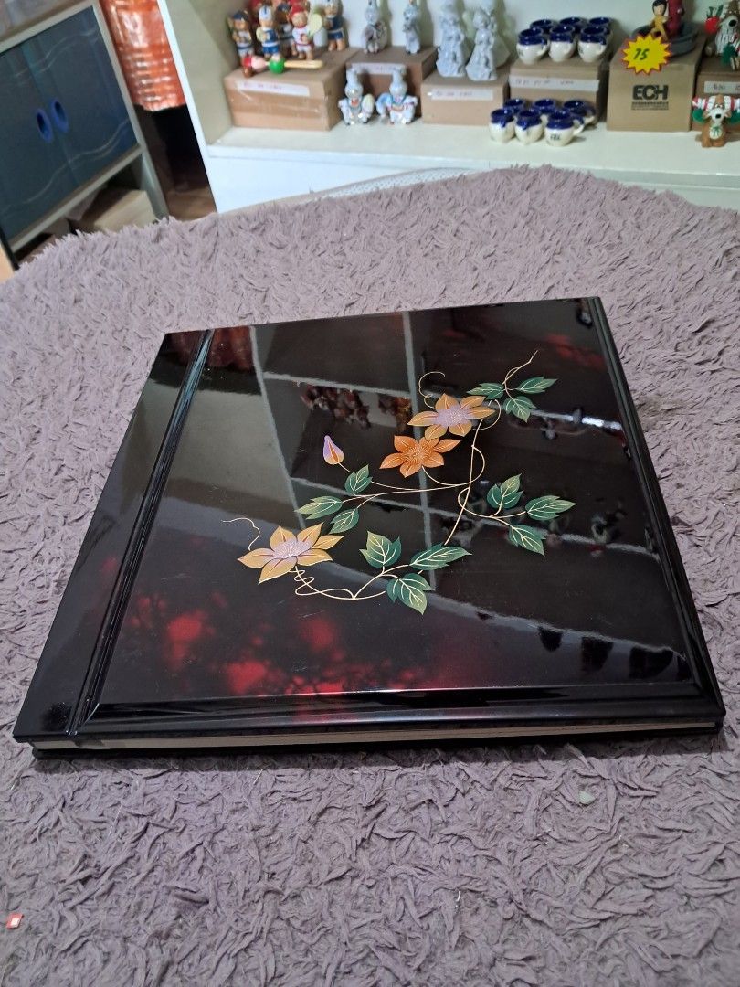 Photo album (Category: Frames & Pictures) located in Cavite. Submitted by secretjapansurplus (Listing ID 1470187395, Image 1). Description: Authentic Vintage Japanese Lacquerware Photo Album. Features a glossy black finish with a hand-painted floral clematis motif. Comes with its original storage box. Excellent unused old stock condition; looks and feels brand new. Perfect as a high-end scrapbook, memory book, or beautiful coffee table display pi