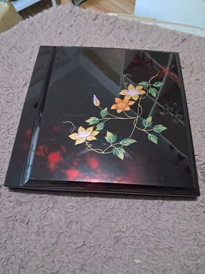 Photo album (Category: Frames & Pictures) located in Cavite. Submitted by secretjapansurplus (Listing ID 1470187395, Image 2). Description: Authentic Vintage Japanese Lacquerware Photo Album. Features a glossy black finish with a hand-painted floral clematis motif. Comes with its original storage box. Excellent unused old stock condition; looks and feels brand new. Perfect as a high-end scrapbook, memory book, or beautiful coffee table display pi