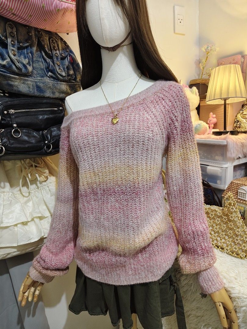 Pink gradient off-shoulder knit sweater (Category: Longsleeves) located in Manila. Submitted by chynii_28 (Listing ID 1470206194, Image 3). Description: - Style: Chunky knit sweater with an off-shoulder neckline - Colors: Soft ombre with pink, yellow, and pastel stripes - Fit: Relaxed fit with long sleeves - Details: Ribbed hem and cuffs - Material: Warm, soft, and cozy -kids size but fut Small-medium .