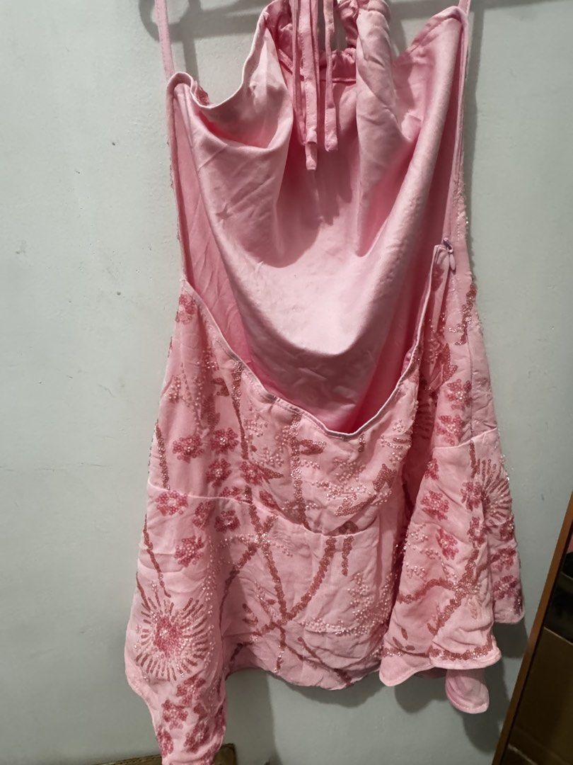 Pink Halter Neck Sequin Mini Dress (Category: Dresses) located in Marikina City. Submitted by potchayy (Listing ID 1470263569, Image 2). Description: - Color: Light pink - Design: Halter neck with all-over sequin beadwork and embroidery - Back: Open back design with adjustable neck ties - Closure: Side zipper closure - Fit: Flared skirt section - Condition: Worn once, in great shape.