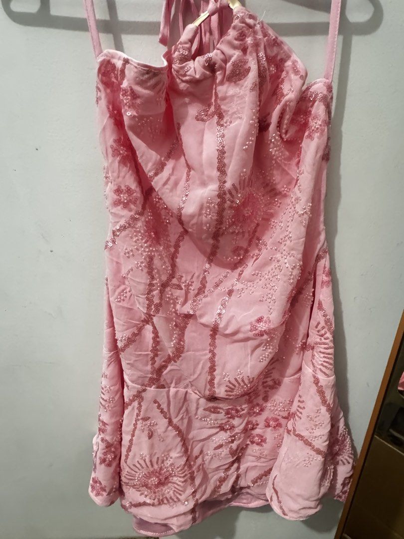 Pink Halter Neck Sequin Mini Dress (Category: Dresses) located in Marikina City. Submitted by potchayy (Listing ID 1470263569, Image 1). Description: - Color: Light pink - Design: Halter neck with all-over sequin beadwork and embroidery - Back: Open back design with adjustable neck ties - Closure: Side zipper closure - Fit: Flared skirt section - Condition: Worn once, in great shape.