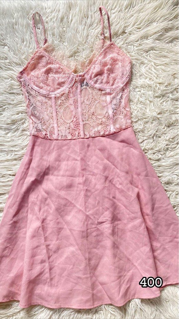 Pink Lace Corset Mini Dress Spaghetti Strap (Category: Dresses) located in Tabaco. Submitted by camila_p (Listing ID 1470155102, Image 1). Description: - Color: Light pink - Style: Mini dress with sheer lace corset bodice - Details: Underwire cups, front boning, and scalloped lace trim - Straps: Adjustable spaghetti straps - Skirt: Flowy chiffon - Closure: Back zipper - Vibe: Super feminine, ideal for dates and parties - Condition: Never worn, Ta