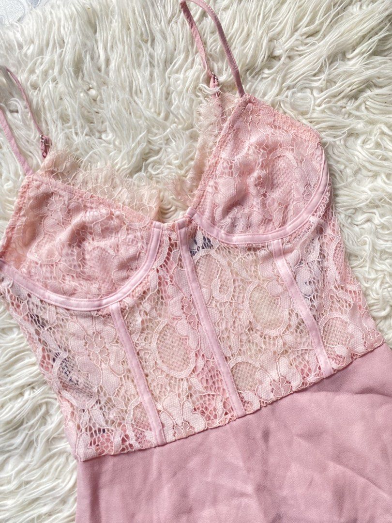 Pink Lace Corset Mini Dress Spaghetti Strap (Category: Dresses) located in Tabaco. Submitted by camila_p (Listing ID 1470155102, Image 3). Description: - Color: Light pink - Style: Mini dress with sheer lace corset bodice - Details: Underwire cups, front boning, and scalloped lace trim - Straps: Adjustable spaghetti straps - Skirt: Flowy chiffon - Closure: Back zipper - Vibe: Super feminine, ideal for dates and parties - Condition: Never worn, Ta