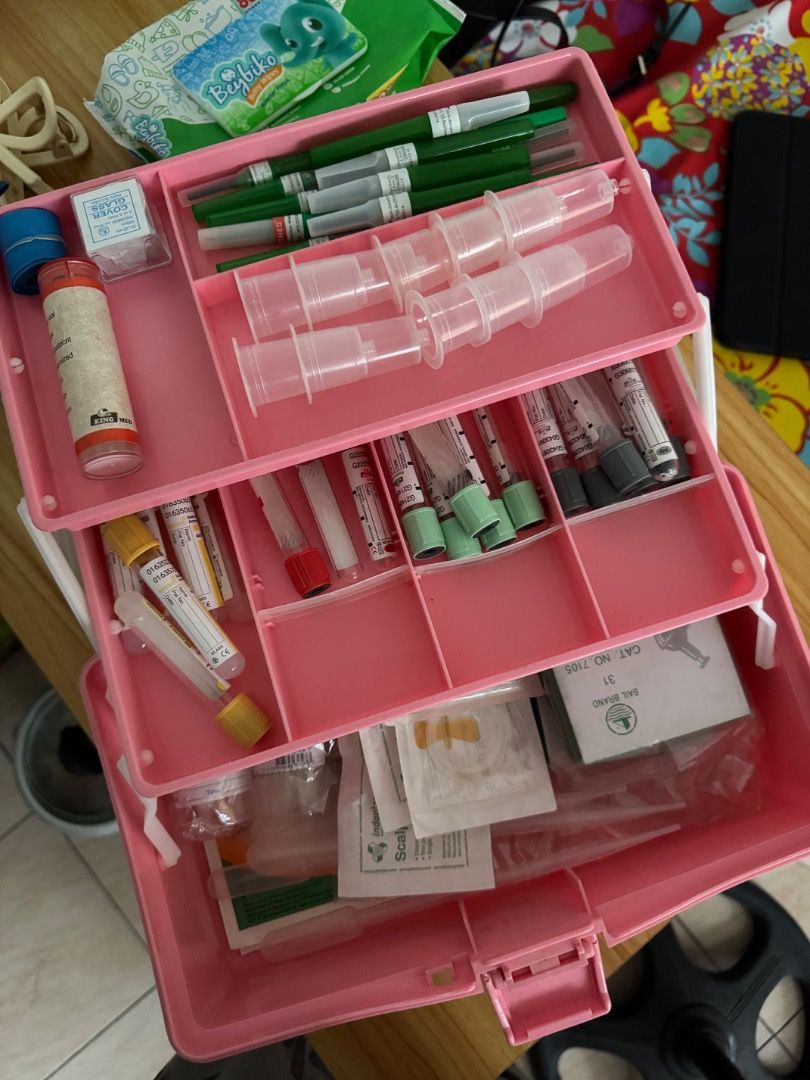 Tackle box with medical supplies (Category: Storage Boxes & Baskets) located in Manila. Submitted by matchalant (Listing ID 1470210874, Image 2). Description: - Color: Bright pink with a clear lid - Design: Multi-tier with lots of internal compartments and secure front clasp - Portability: Features a sturdy top handle for easy carrying - Versatility: Great for organizing small tools, craft items, or medical and lab supplies - Condition: Clean int