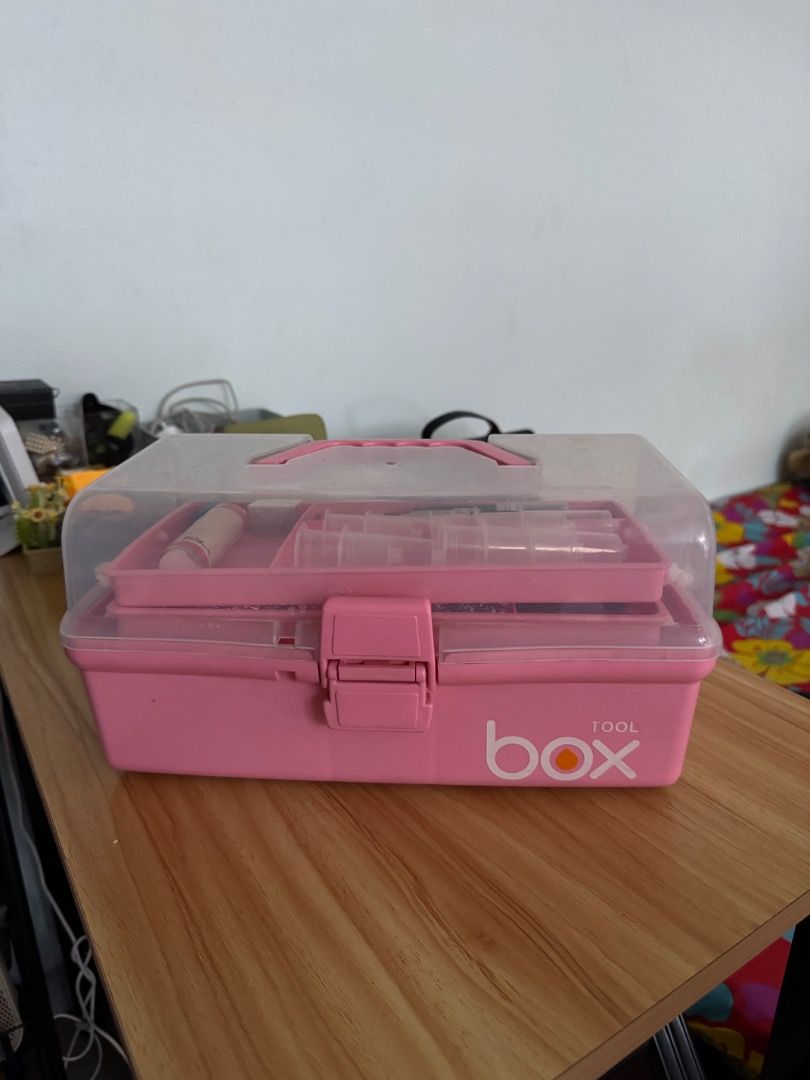 Tackle box with medical supplies (Category: Storage Boxes & Baskets) located in Manila. Submitted by matchalant (Listing ID 1470210874, Image 1). Description: - Color: Bright pink with a clear lid - Design: Multi-tier with lots of internal compartments and secure front clasp - Portability: Features a sturdy top handle for easy carrying - Versatility: Great for organizing small tools, craft items, or medical and lab supplies - Condition: Clean int