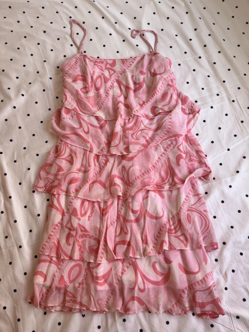 Pink patterned tiered ruffle cami dress spaghetti straps (Category: Dresses) located in Manila. Submitted by chimcheese (Listing ID 1470151484, Image 3). Description: Pink and white patterned sleeveless dress. Features layered ruffled tiers cascading down the skirt. Thin spaghetti straps with beaded or braided detailing. Lightweight chiffon-like fabric with a flowy silhouette. Back zipper closure. Soft pastel tones with swirling abstract patterns