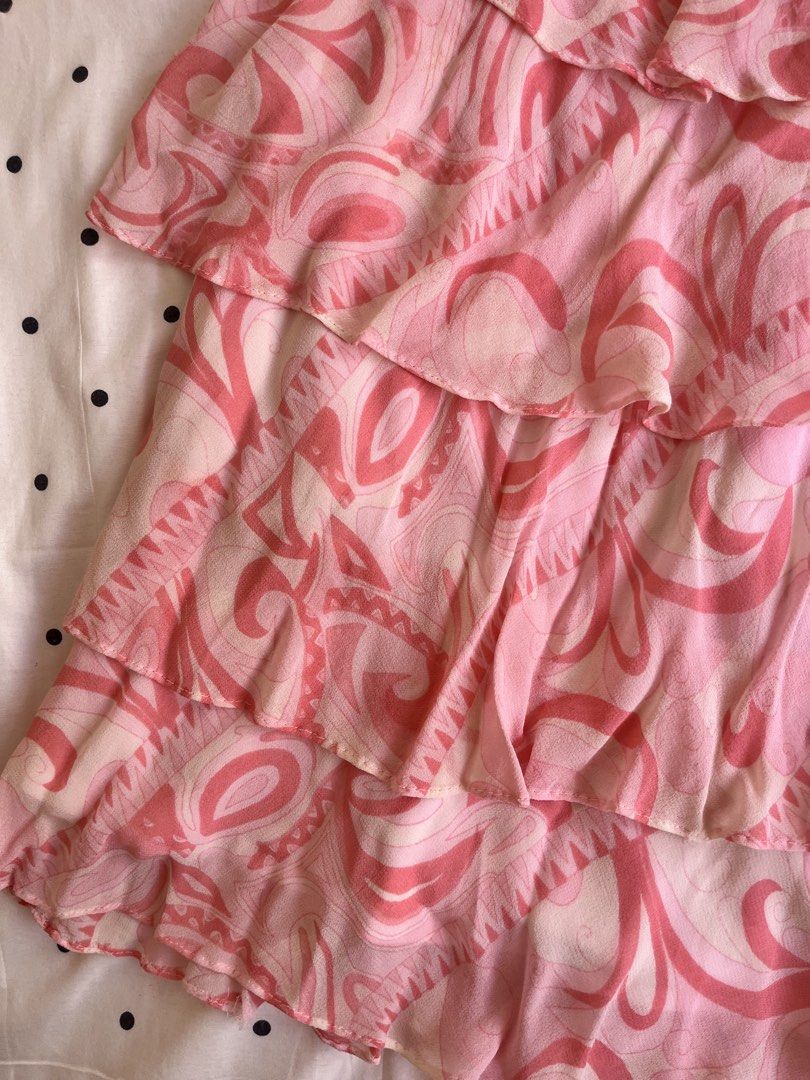 Pink patterned tiered ruffle cami dress spaghetti straps (Category: Dresses) located in Manila. Submitted by chimcheese (Listing ID 1470151484, Image 2). Description: Pink and white patterned sleeveless dress. Features layered ruffled tiers cascading down the skirt. Thin spaghetti straps with beaded or braided detailing. Lightweight chiffon-like fabric with a flowy silhouette. Back zipper closure. Soft pastel tones with swirling abstract patterns