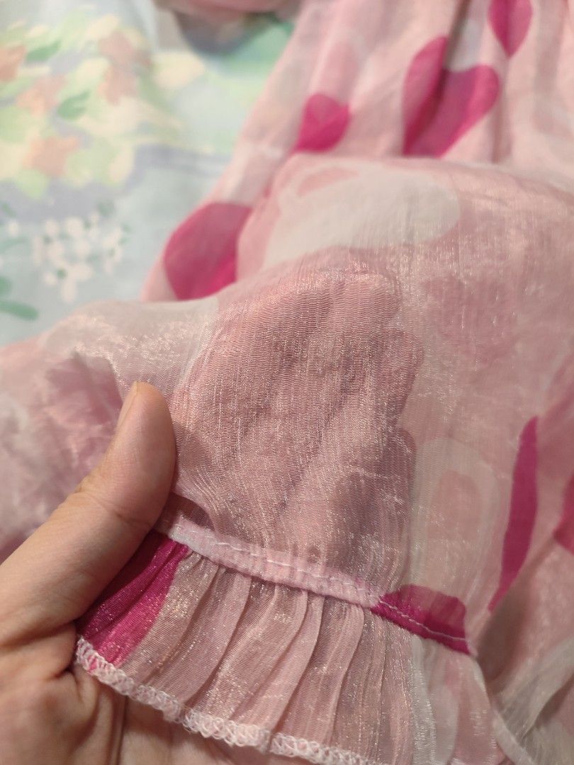 Pink Polka Dot Chiffon Mini Dress Ruffle Hem (Category: Dresses) located in Jaen. Submitted by roxantiago (Listing ID 1470219655, Image 3). Description: - Color: Light pink with bold magenta polka dots - Material: Sheer airy chiffon with a soft slip lining - Design: V-neckline, empire waist with gentle gathering, and ruffled hem - Sleeves: Half sleeves with elastic cuffs and small ruffles - Style: Fun, breezy, and perfect for warm weather xs to m