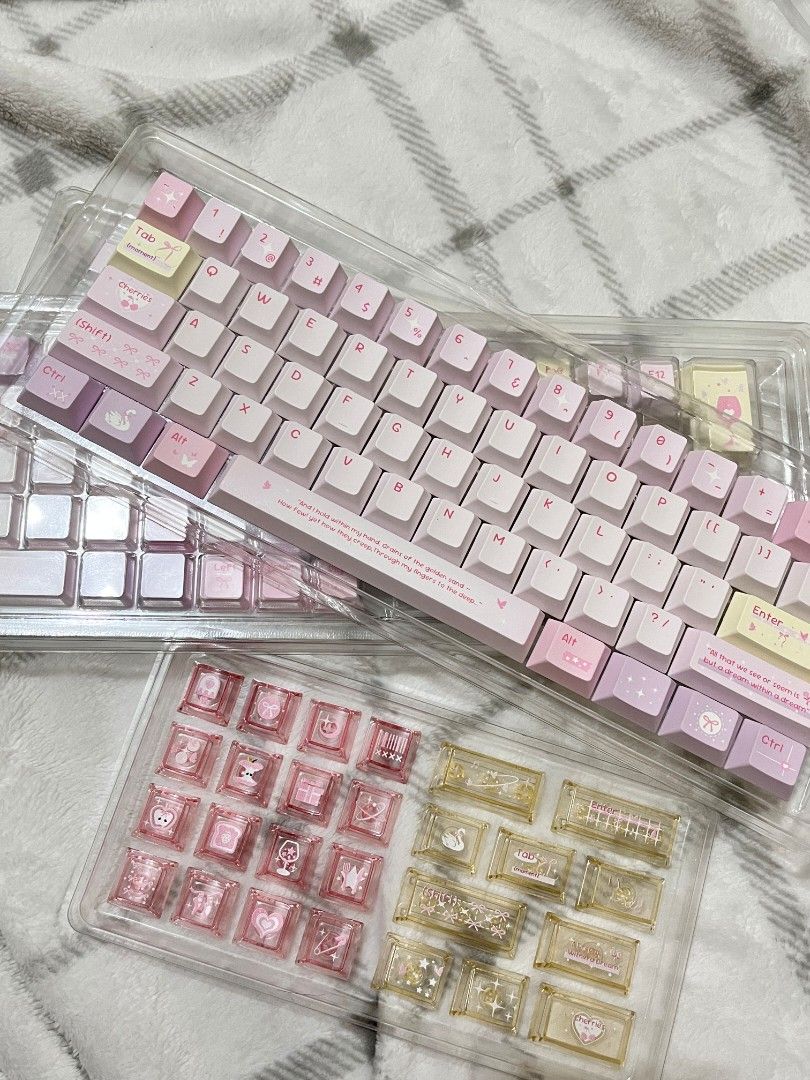 Purple/Pink keycaps (Category: Computer Keyboard) located in Bulacan. Submitted by lexareads (Listing ID 1470253490, Image 1). Description: - Full set of pink, purple, and pastel yellow keycaps - Good for all keyboard layouts (68, 75, 87, 100%) - Includes PC in pink and yellow colors - With keycap puller.