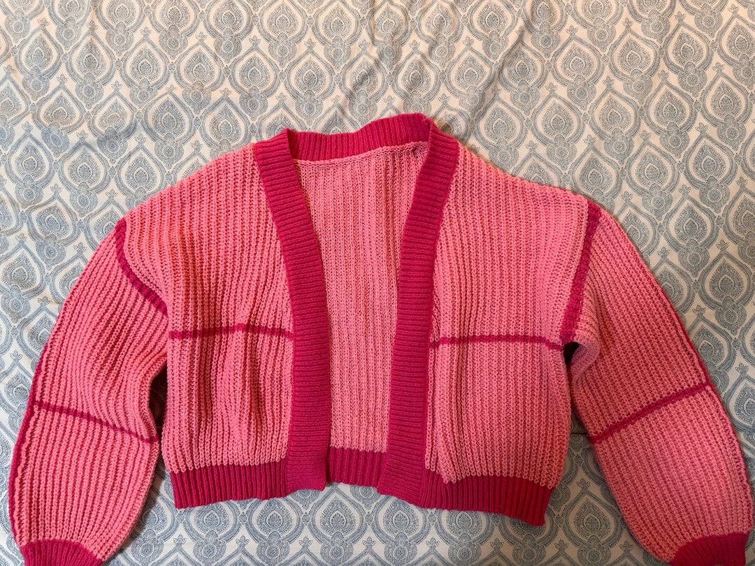 Pink Ribbed Knit Open Front Cardigan Sweater (Category: Coats, Jackets and Outerwear) located in Quezon City. Submitted by monique29_ (Listing ID 1470278185, Image 1). Description: * WORN ONCE* - Color: Bright pink with contrasting dark pink trim - Style: Open-front, chunky ribbed texture - Fit: Comfy fit, sits around the waist - Material: Soft knit fabric ideal for cooler days - Condition: Clean and ready to wear.