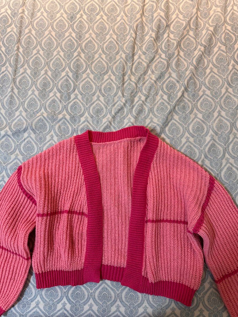 Pink Ribbed Knit Open Front Cardigan Sweater (Category: Coats, Jackets and Outerwear) located in Quezon City. Submitted by monique29_ (Listing ID 1470278185, Image 2). Description: * WORN ONCE* - Color: Bright pink with contrasting dark pink trim - Style: Open-front, chunky ribbed texture - Fit: Comfy fit, sits around the waist - Material: Soft knit fabric ideal for cooler days - Condition: Clean and ready to wear.
