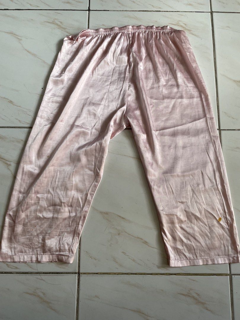 Pink Satin Pyjamas Set with Red Balloons Print (Category: Undergarments & Loungewear) located in Pasig City. Submitted by khaleisi (Listing ID 1470228524, Image 3). Description: - Pink satin pyjama set with long sleeves and pants - Features a playful all-over print of red balloons, lips, and cursive writing - Button-up top complete with a convenient chest pocket - Pants designed with a comfortable elastic waistband - Silky smooth, lightweight mat
