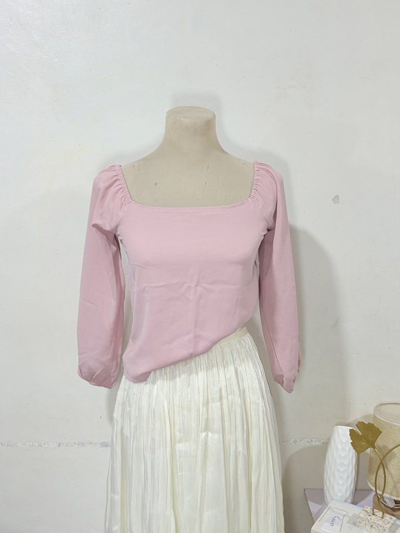 Pink square neck long sleeve blouse size small medium (Category: Longsleeves) located in Manila. Submitted by biacakes (Listing ID 1470262681, Image 2). Description: - Color: Pastel pink - Style: Square neck with long sleeves and gathered shoulder details - Fit: Comfortably fits small to medium frames - Versatility: Easy to pair with skirts or high-waisted pants - Condition: Clean fabric, minimal wear.