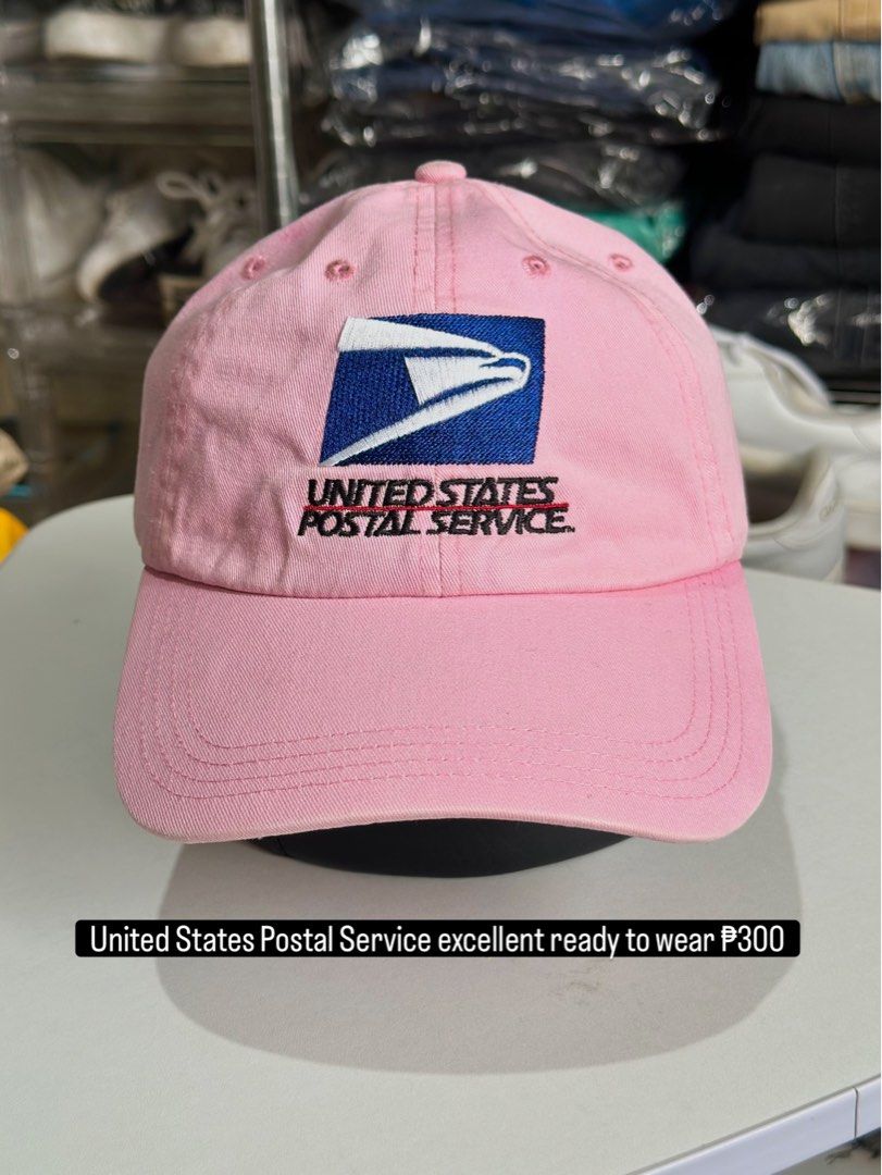 Pink USPS United States Postal Service Cap (Category: Caps & Hats) located in Daet. Submitted by thrifthings2018 (Listing ID 1470193781, Image 1). Description: - Brand: Cap America - Design: Pink baseball cap with embroidered USPS logo - Fit: Adjustable back strap with brass buckle hardware - Condition: Clean fabric throughout, ready to wear - Origin: Made in China.